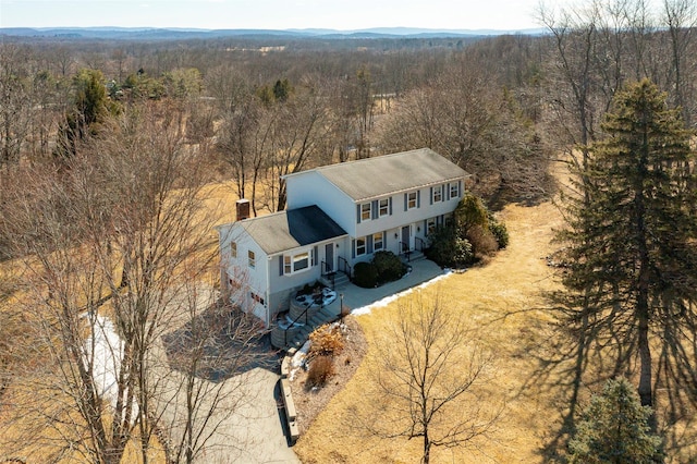 drone / aerial view with a view of trees