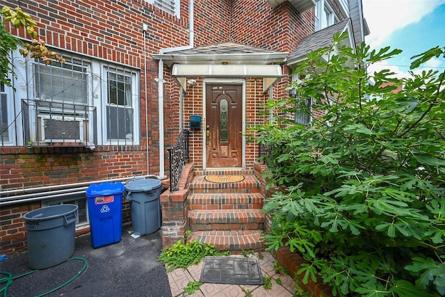 entrance to property with brick siding