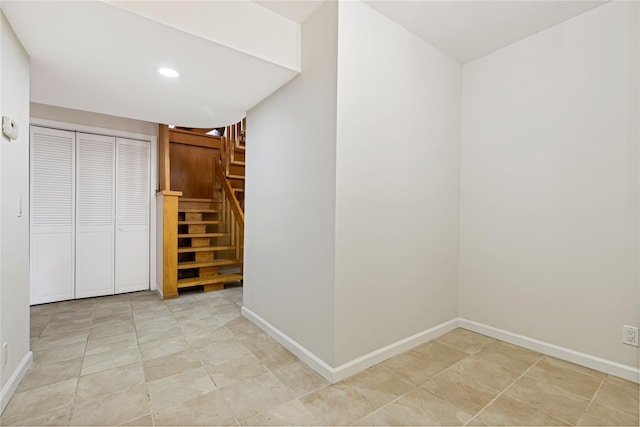 interior space with stairway, recessed lighting, and baseboards