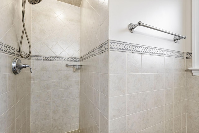 bathroom with tiled shower