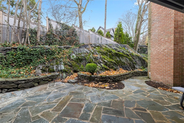 view of patio / terrace featuring fence