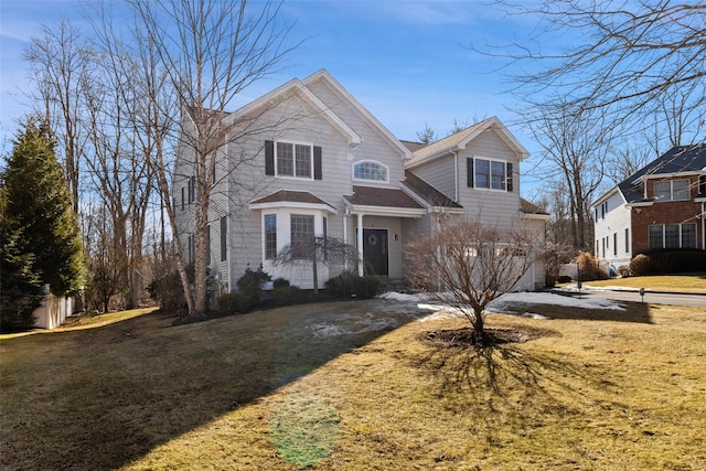 view of front of house with a garage and a front lawn