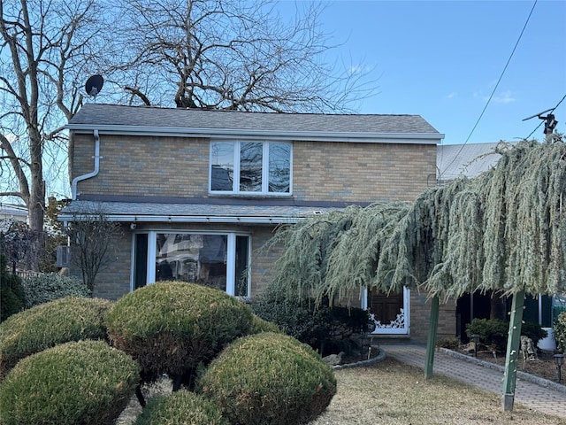 view of front of property featuring brick siding