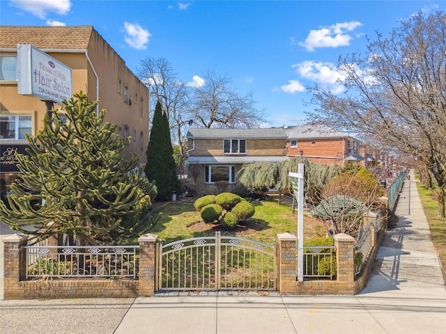 view of front of property with fence and a gate