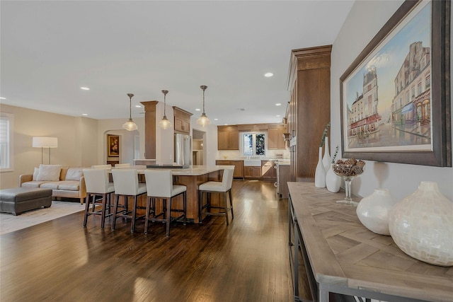 dining space with recessed lighting and dark wood-style flooring