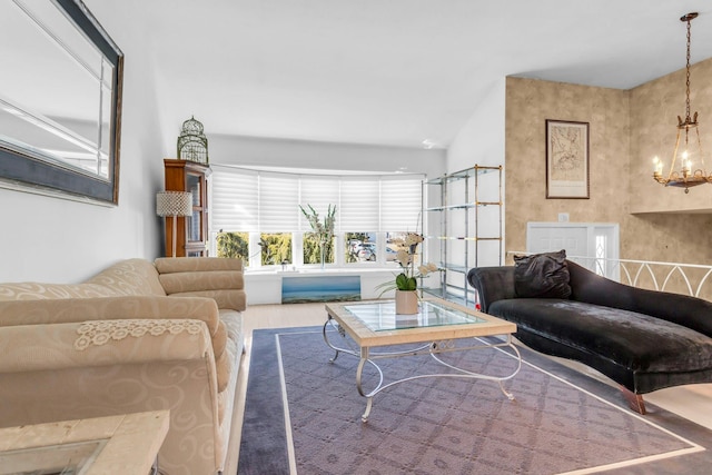 living room with vaulted ceiling and an inviting chandelier