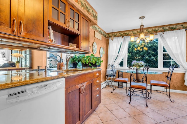 kitchen with hanging light fixtures, white dishwasher, an inviting chandelier, and brown cabinets