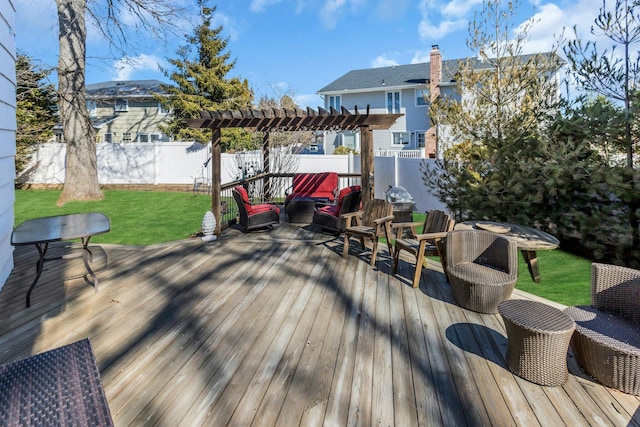 wooden terrace with a fenced backyard, a pergola, and a yard