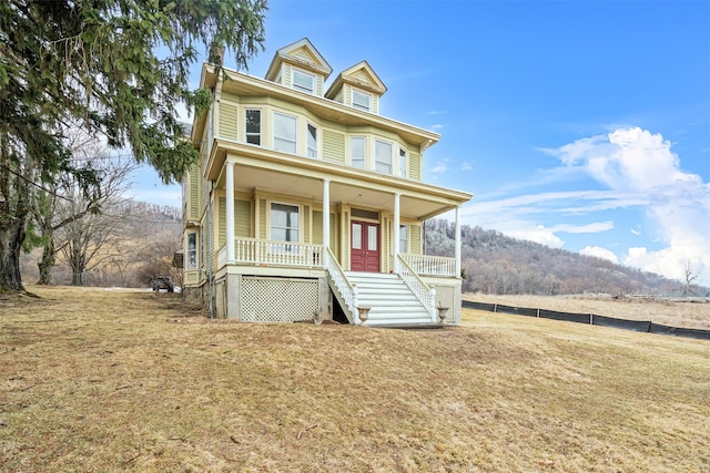 traditional style home with a porch and stairway