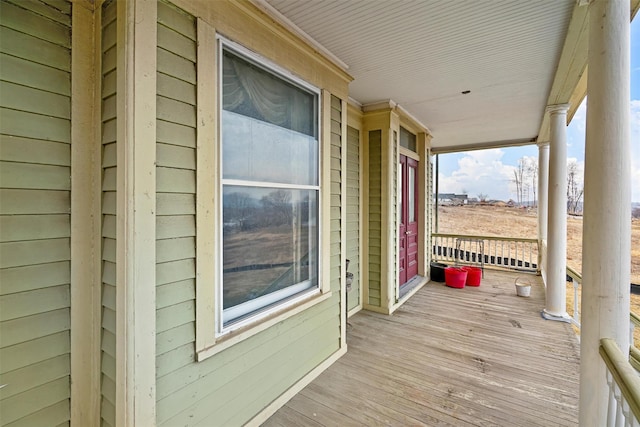 wooden terrace with a porch