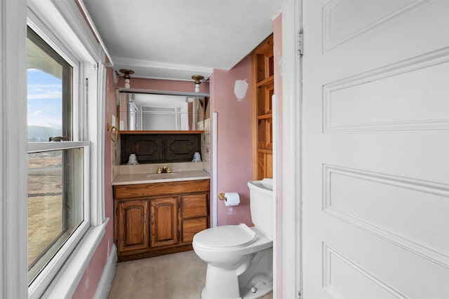 half bathroom featuring toilet and vanity