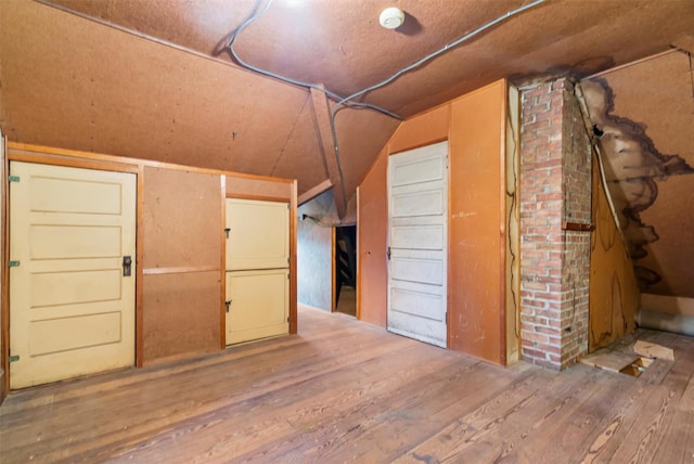 basement with hardwood / wood-style floors