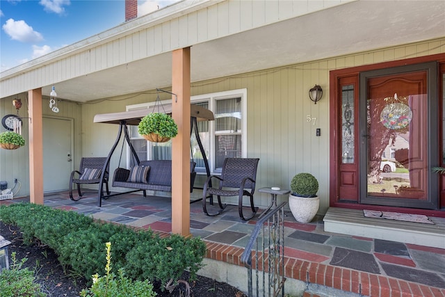 property entrance featuring covered porch