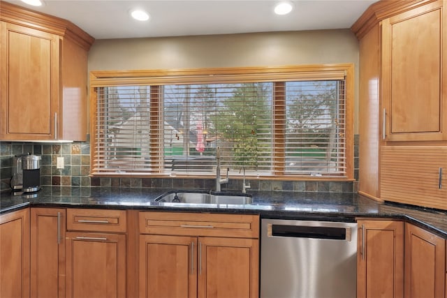 kitchen featuring a sink, brown cabinetry, backsplash, and stainless steel dishwasher