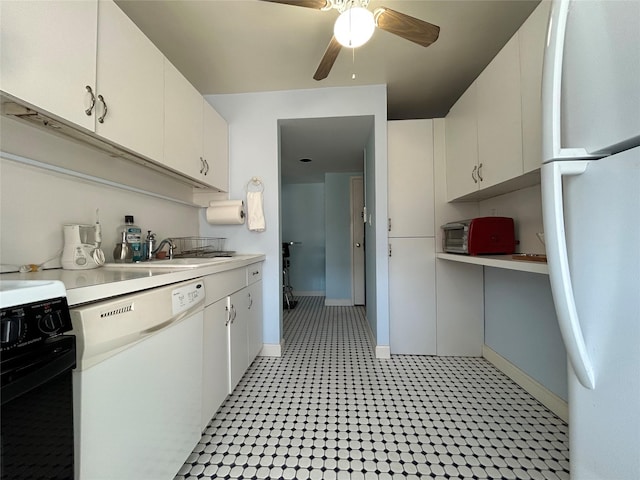 kitchen with a toaster, white appliances, a sink, a ceiling fan, and light countertops