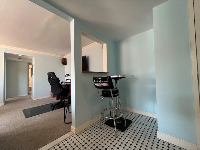 interior space with crown molding and baseboards