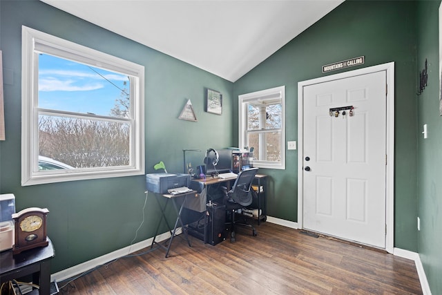 office with lofted ceiling, plenty of natural light, wood finished floors, and baseboards