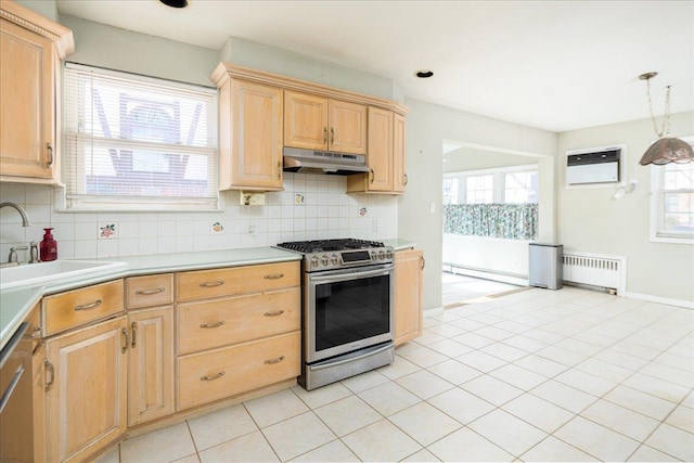 kitchen featuring radiator, stainless steel appliances, under cabinet range hood, light brown cabinets, and a sink