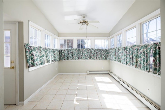 unfurnished sunroom with a baseboard heating unit, lofted ceiling, and a healthy amount of sunlight