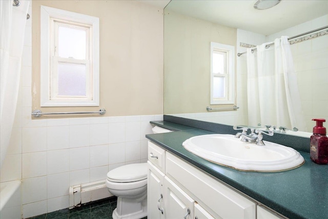 full bath with tile walls, curtained shower, toilet, baseboard heating, and vanity