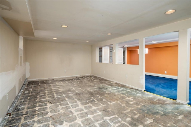 finished basement with recessed lighting and baseboards