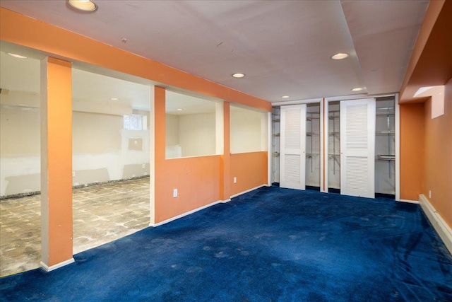 carpeted spare room featuring recessed lighting and baseboards