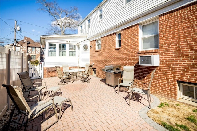 view of patio / terrace featuring outdoor dining space and fence