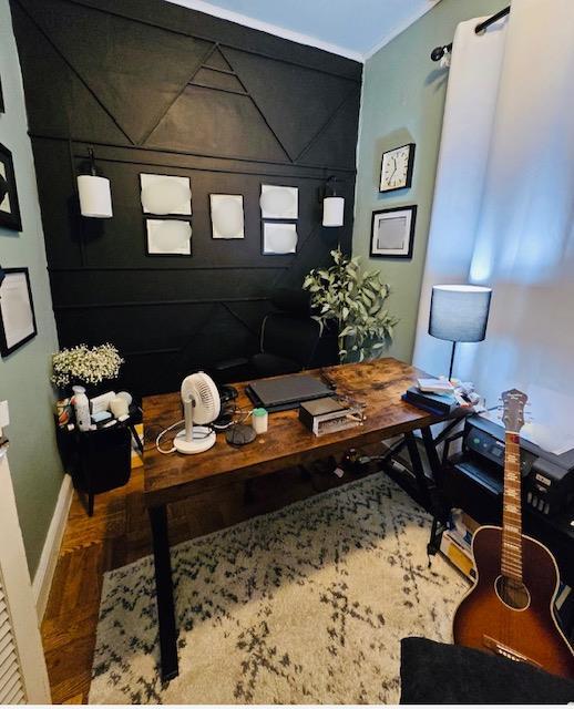 office area featuring baseboards and wood finished floors