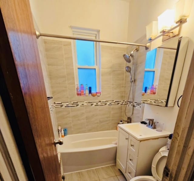 full bathroom with toilet, tile patterned floors, vanity, and shower / bathing tub combination