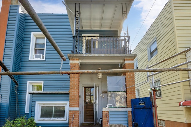 3709 20th Rd, Astoria, NY 11105 - view of front of house with a balcony and brick siding