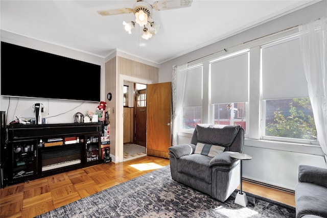 3709 20th Rd, Astoria, NY 11105 - living area featuring ornamental molding, healthy amount of natural light, and a ceiling fan