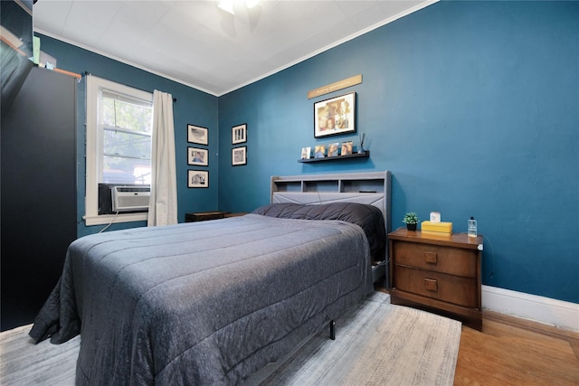 3709 20th Rd, Astoria, NY 11105 - bedroom with wood finished floors, ornamental molding, cooling unit, and baseboards