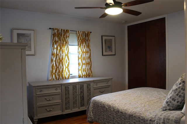 bedroom featuring dark wood-style floors and a ceiling fan