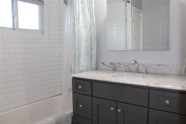 full bath with shower / bath combo with shower curtain and vanity