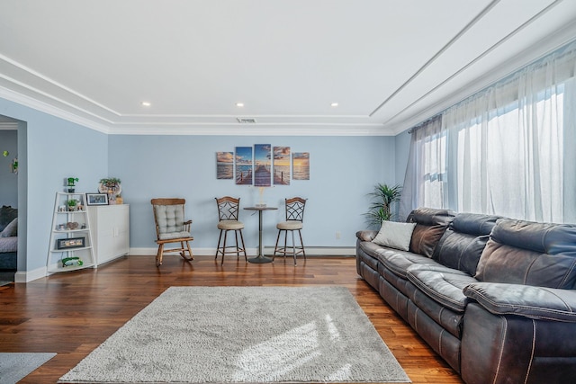 living room featuring baseboards, baseboard heating, and wood finished floors