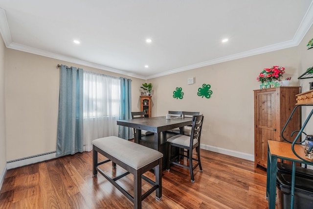 dining room featuring baseboards, crown molding, a baseboard heating unit, and wood finished floors