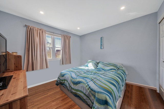 bedroom featuring recessed lighting, wood finished floors, and baseboards