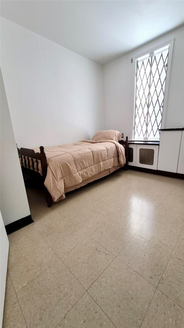 unfurnished bedroom featuring tile patterned floors