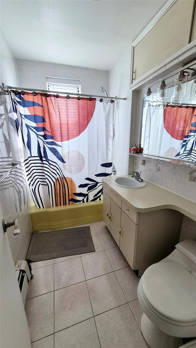 full bath featuring plenty of natural light, toilet, tile patterned flooring, shower / bath combination with curtain, and vanity