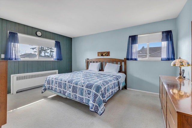 bedroom featuring carpet floors and radiator heating unit