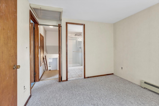 unfurnished bedroom featuring a baseboard radiator, visible vents, connected bathroom, and carpet