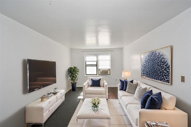 living area featuring cooling unit and baseboards