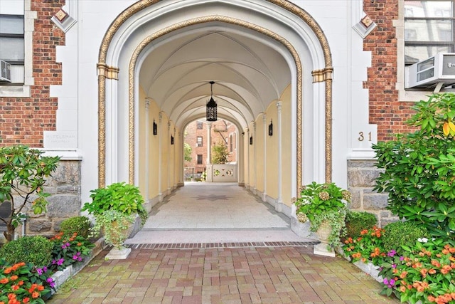 doorway to property featuring brick siding