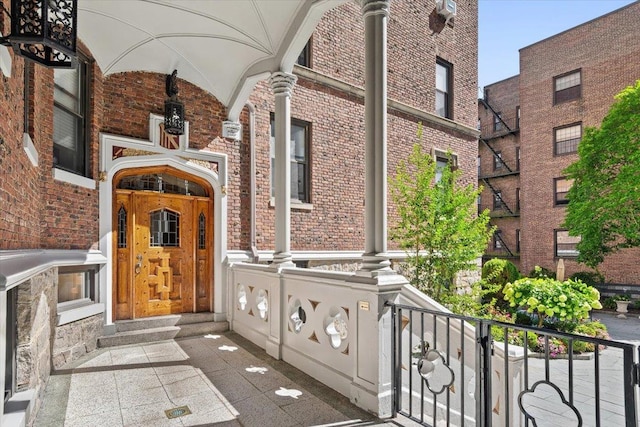 property entrance featuring brick siding