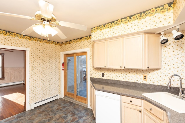 kitchen with a baseboard radiator, white dishwasher, a sink, and wallpapered walls