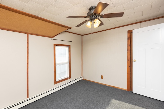 carpeted spare room featuring ornamental molding, a baseboard radiator, and a ceiling fan