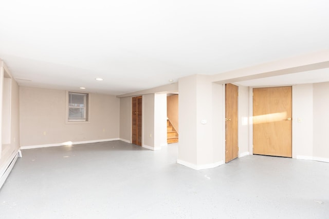 spare room featuring a baseboard heating unit, recessed lighting, stairway, and baseboards