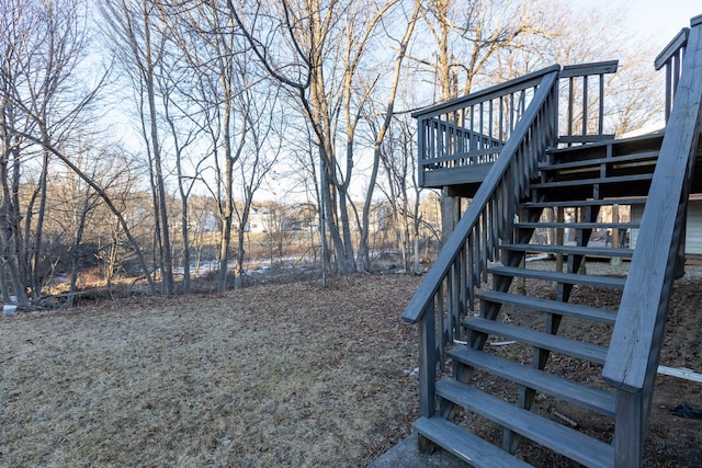 view of yard featuring stairs and a wooden deck