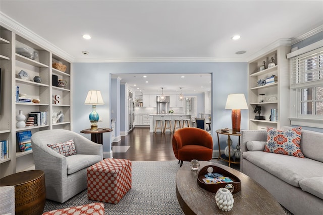 living area with baseboards, ornamental molding, dark wood finished floors, and recessed lighting