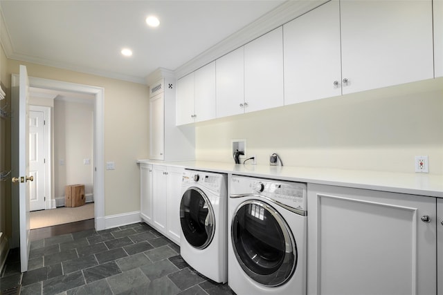 laundry area featuring cabinet space, baseboards, crown molding, washing machine and dryer, and recessed lighting